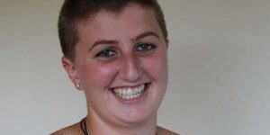 A young woman smiling into the camera