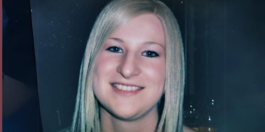 A young woman smiling at the camera
