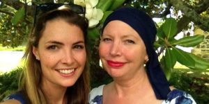 A young woman with her mum who is wearing a headscarf