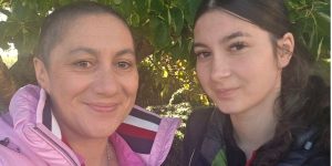 Nikida standing with her daughter