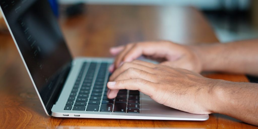 Person typing on a computer
