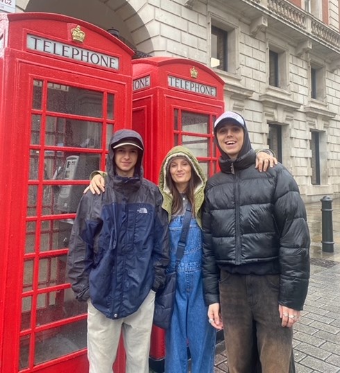 Sara with her two sons infront of a london phone box